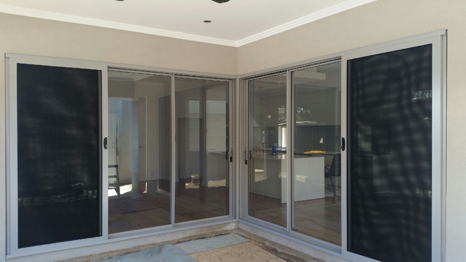 The alfresco area of a house which has double sliding security doors installed.