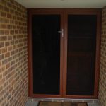 The outside of a household entryway that has Invisi-Gard security screens installed onto the front door.