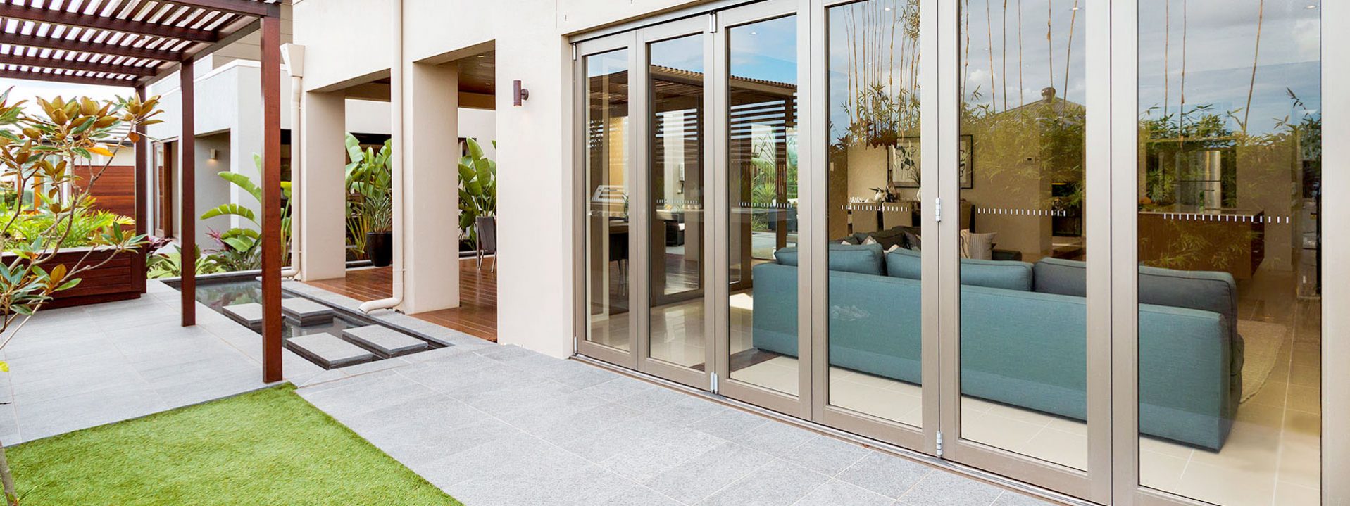 Aluminium bifold security doors located in an O’Connor backyard.
