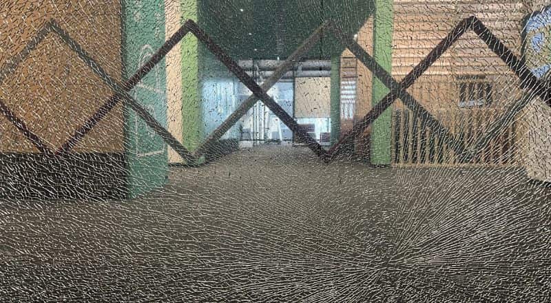 A Sliding door with broken glass.