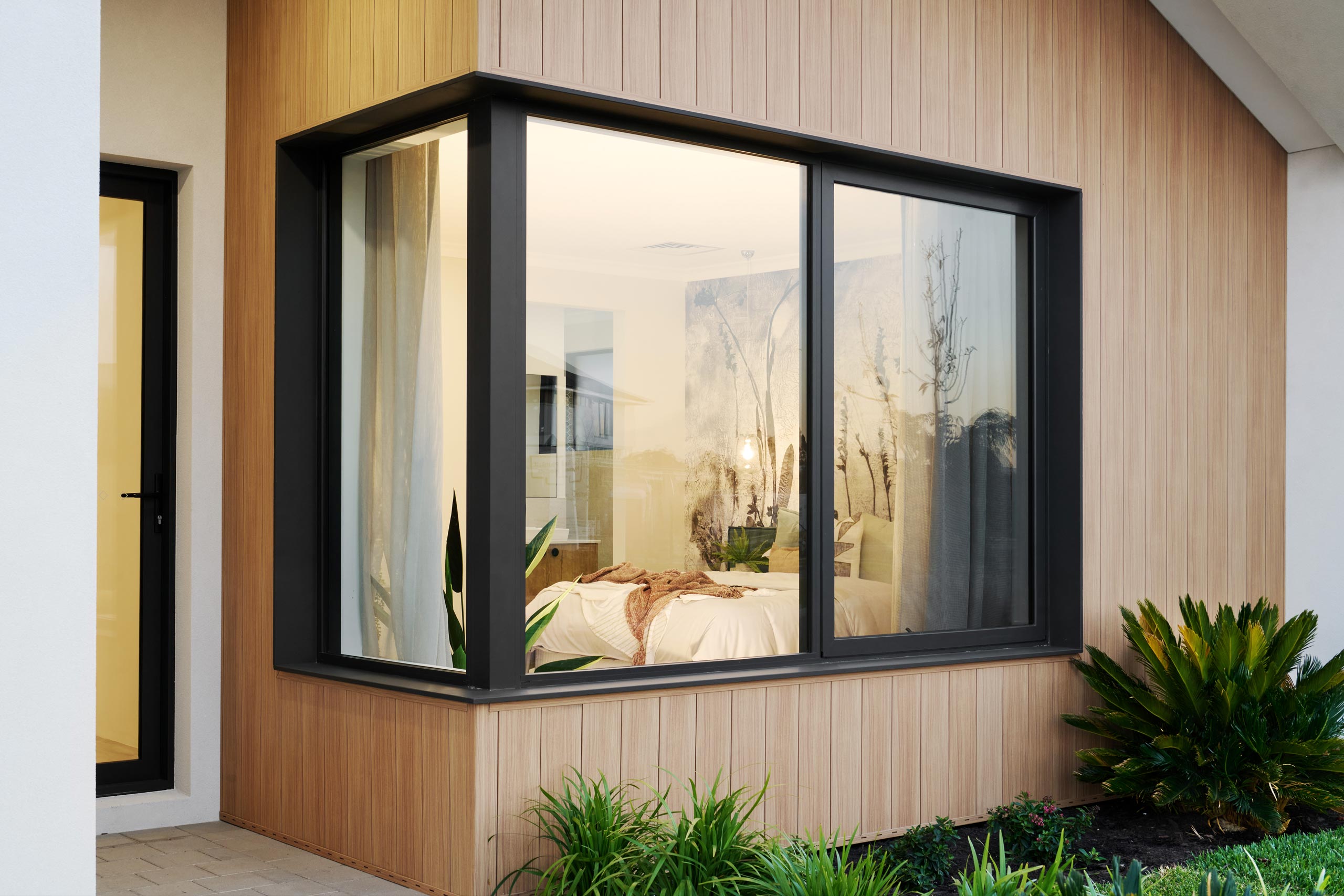 See how dark window frame colours like AZ Custom Black Matt create contrast in contemporary homes. View our aluminium window colour chart for more options.